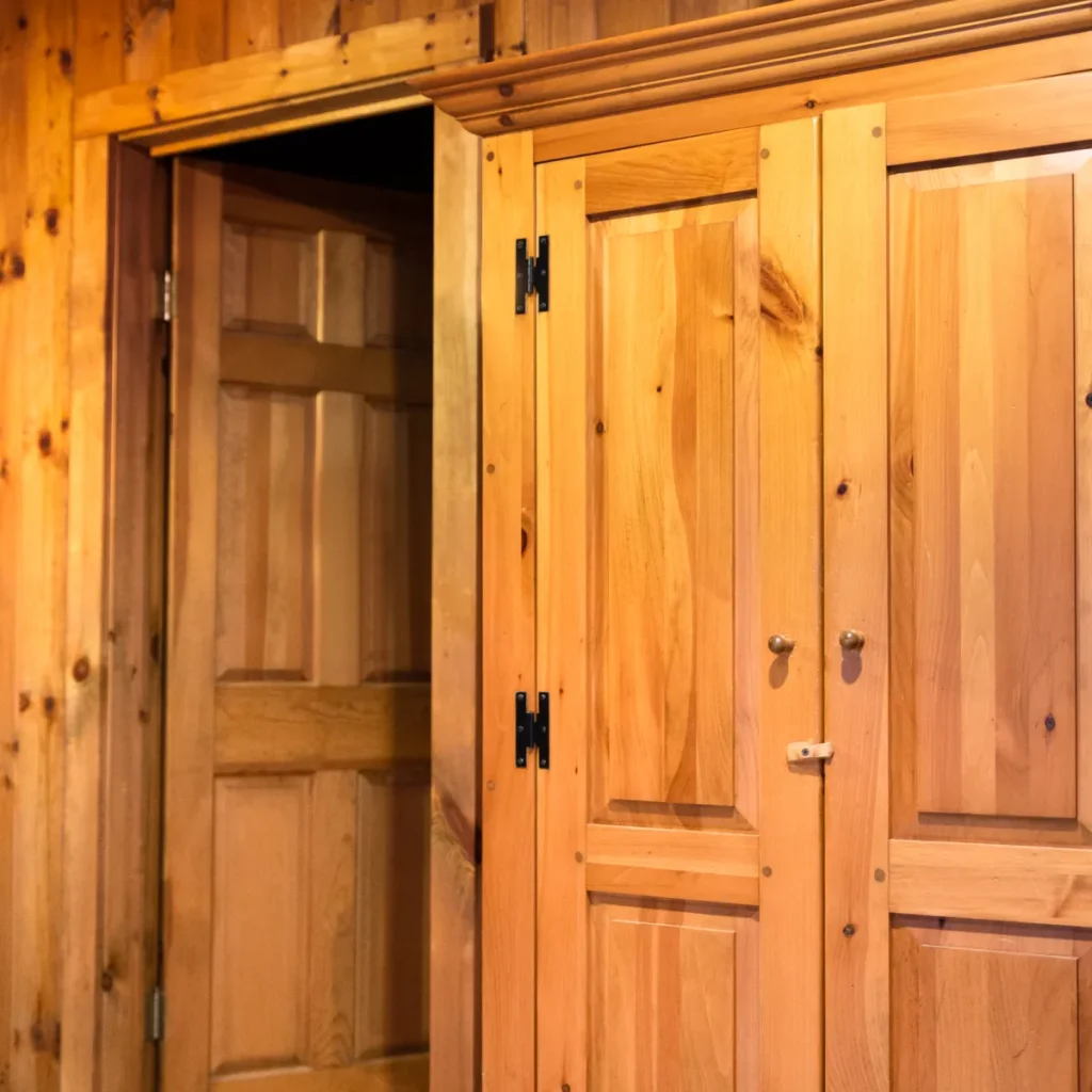 Wooden panelled wall and open door in a home interior