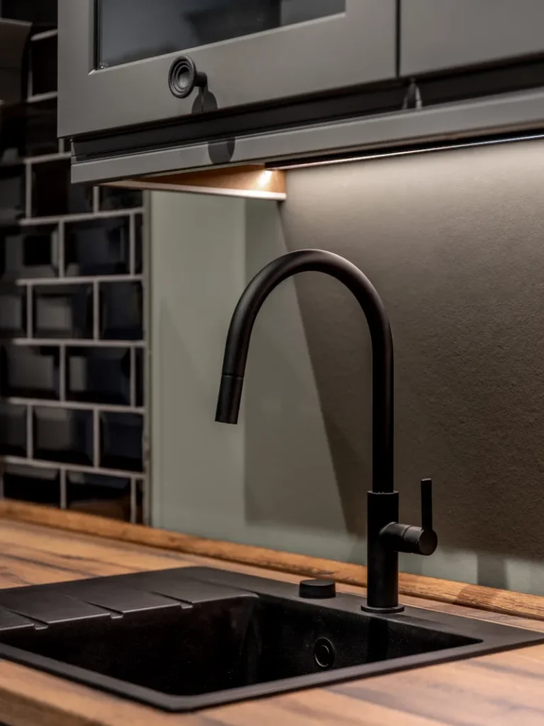 Contemporary kitchen with a matte black tap and sink